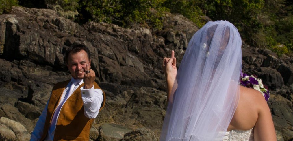 Groom giving his bride the finger