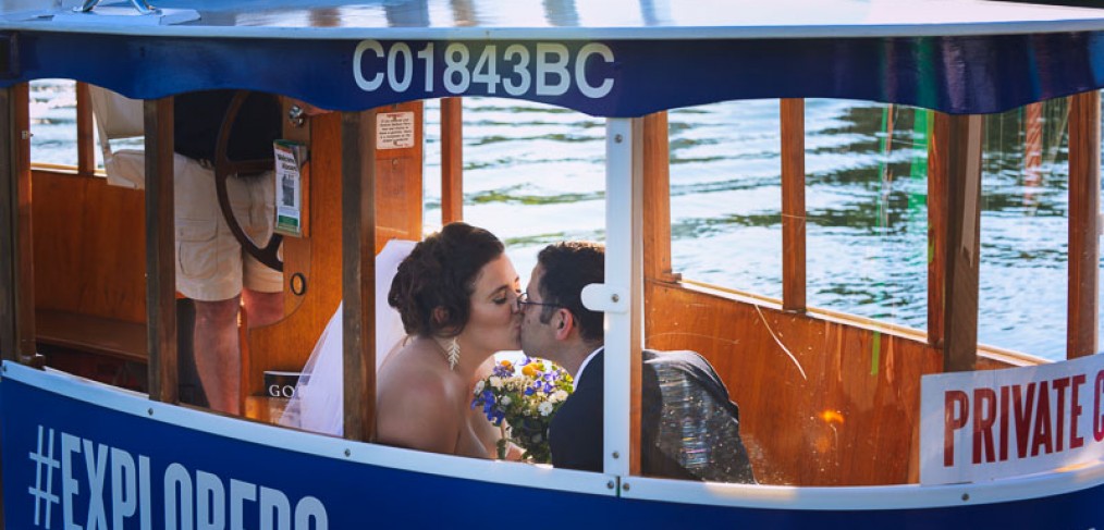 bride and groom in water taxi