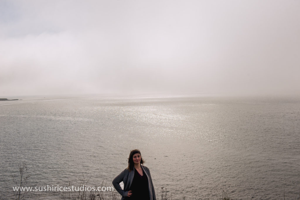 Brand photography hypnotherapist standing in front of the ocean