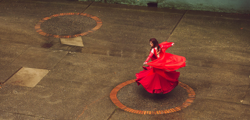 Belly dancer in red in Bastion Square Victoria BC